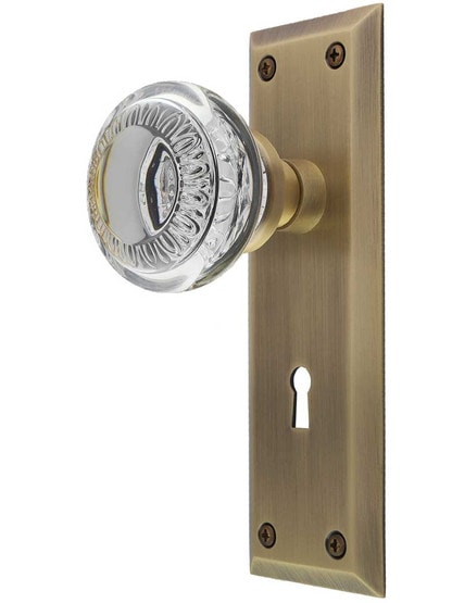 New York Mortise-Lock Set with Ovolo Crystal-Glass Knobs and Keyhole in Antique Brass.